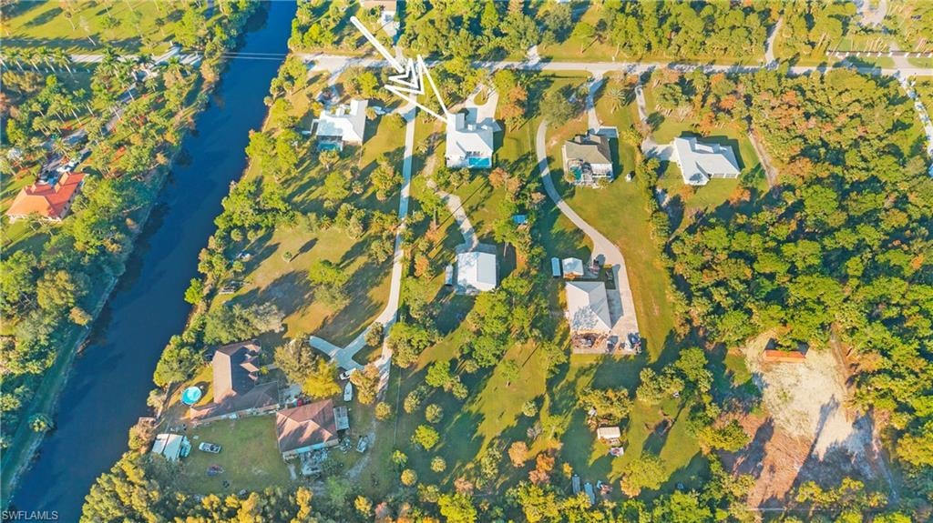 Aerial view of property's location featuring a nearby body of water