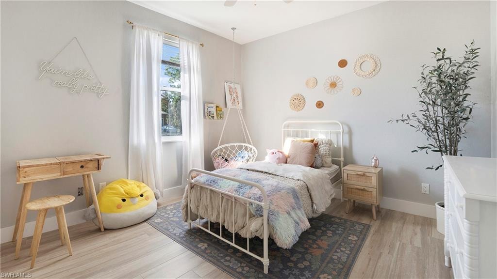 Bedroom featuring light wood-style floors and ceiling fan