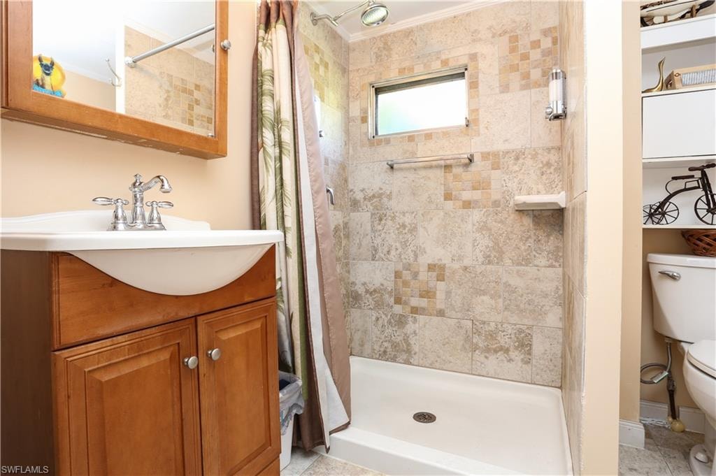 Full bathroom featuring vanity and a stall shower