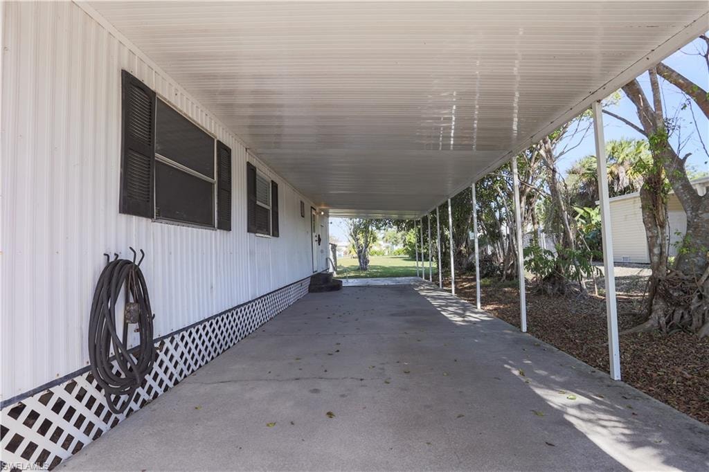 View of patio / terrace featuring a carport