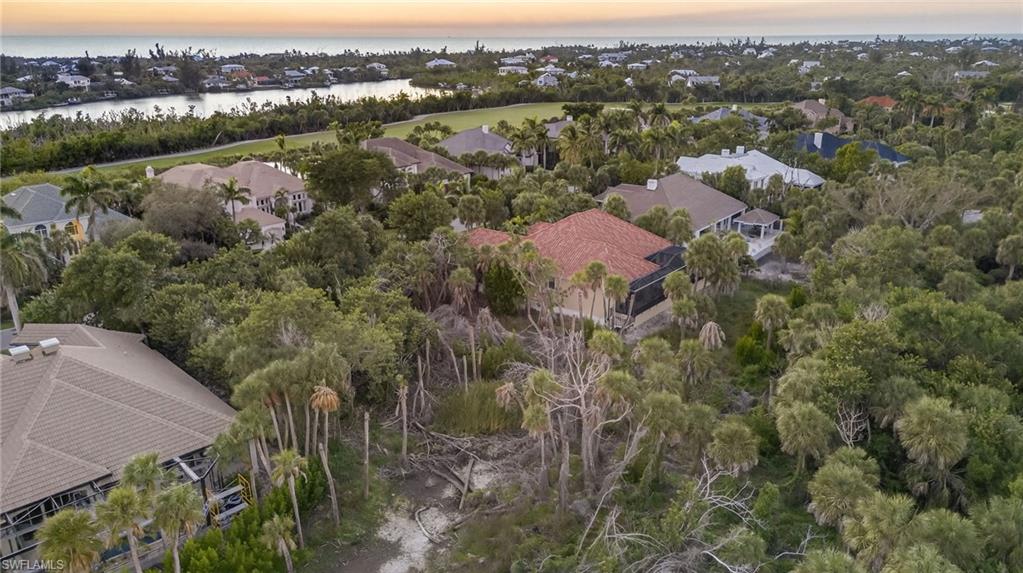 Aerial view at dusk of a water view and a residential view