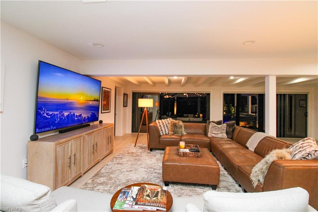 Living room with light hardwood / wood-style floors