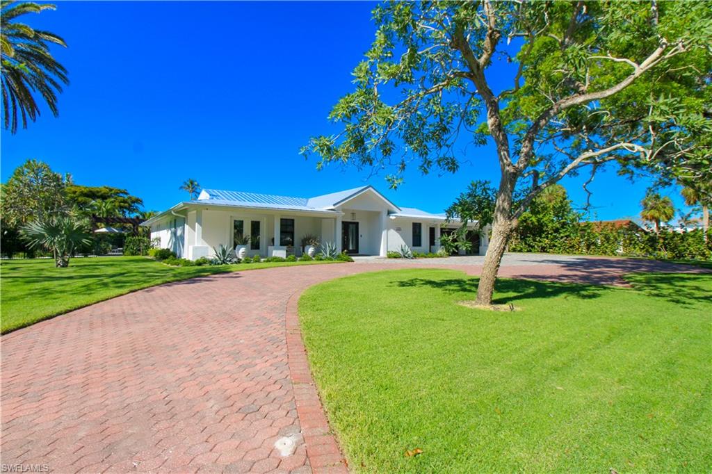 Ranch-style home with a front yard