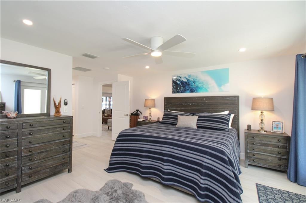 Bedroom featuring ceiling fan and light wood-type flooring