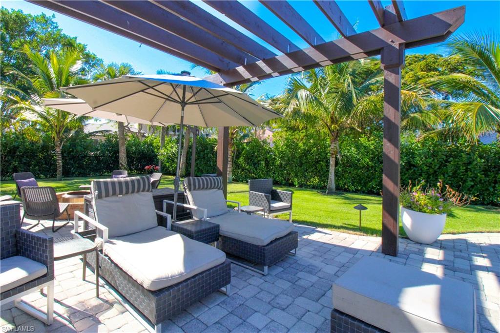 View of patio featuring an outdoor living space and a pergola