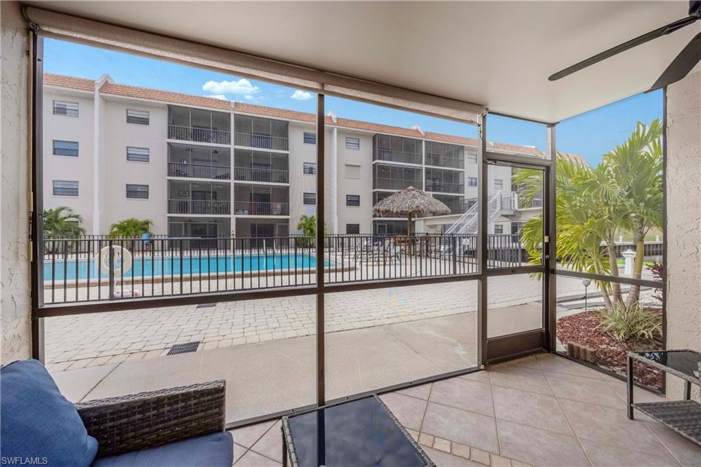 Unfurnished sunroom with ceiling fan