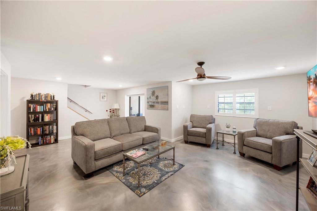 Living room featuring ceiling fan