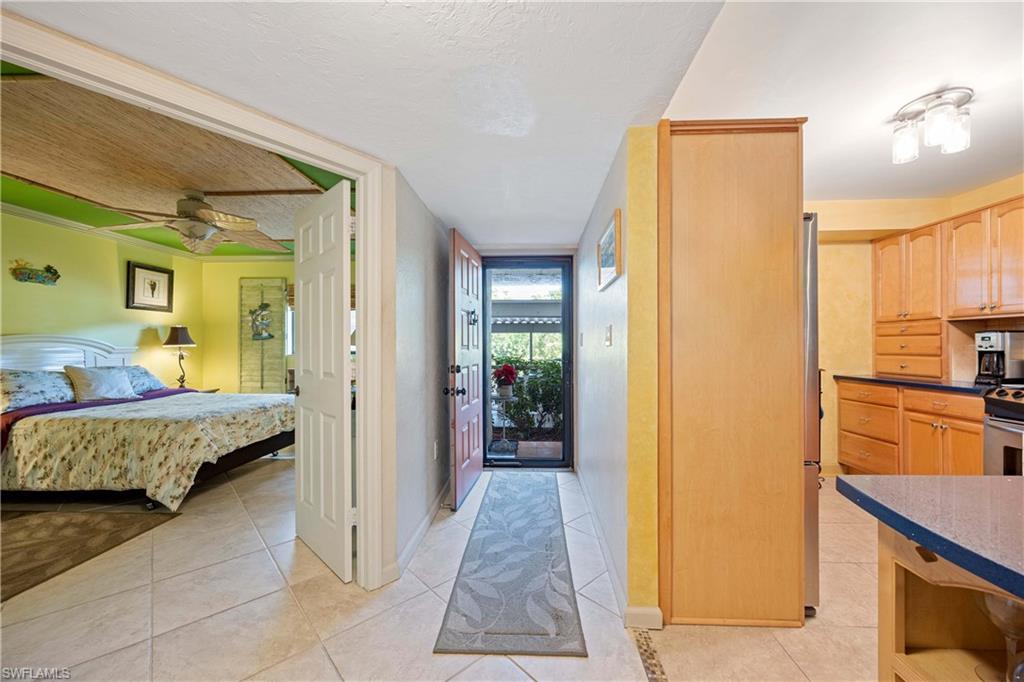 Hall with light tile patterned floors