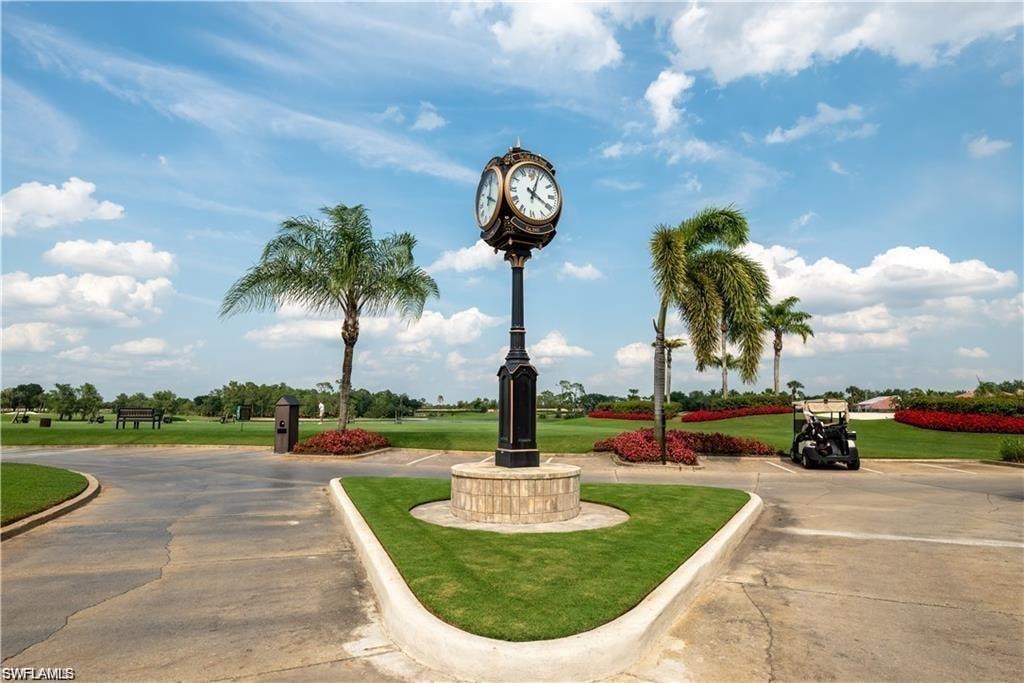 View of property's community featuring a lawn
