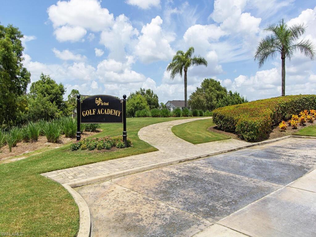 View of home's community with a lawn