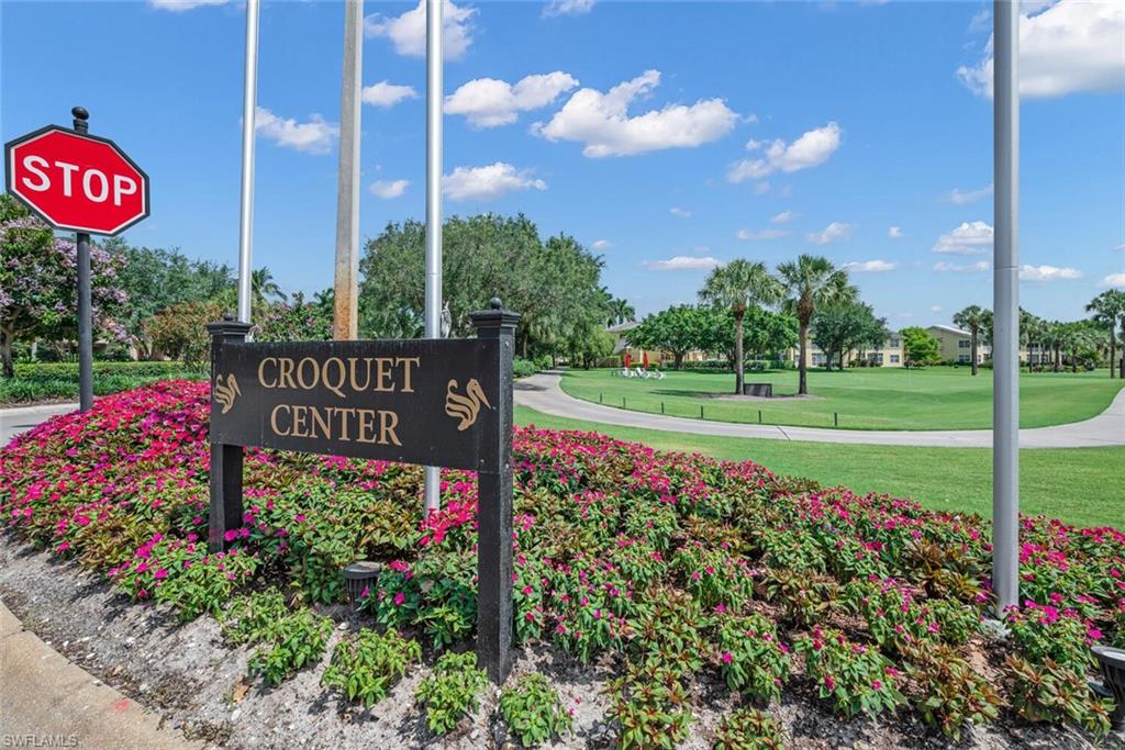 Community sign featuring a lawn