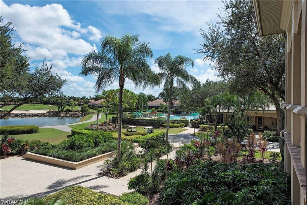 View of community featuring a yard and a water view