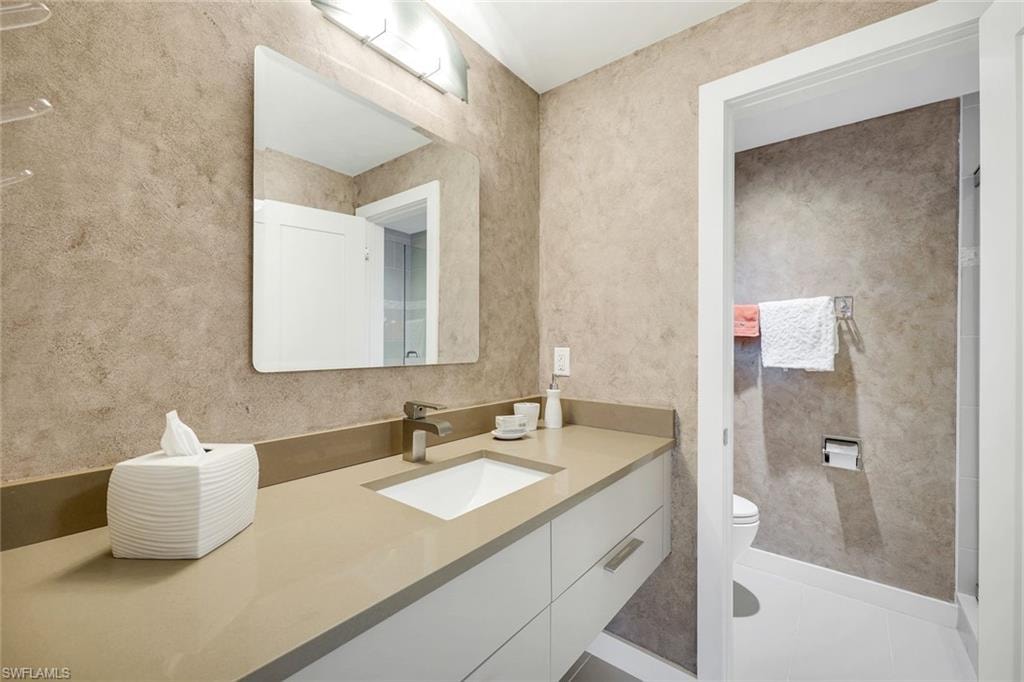 Bathroom with vanity and light tile patterned floors