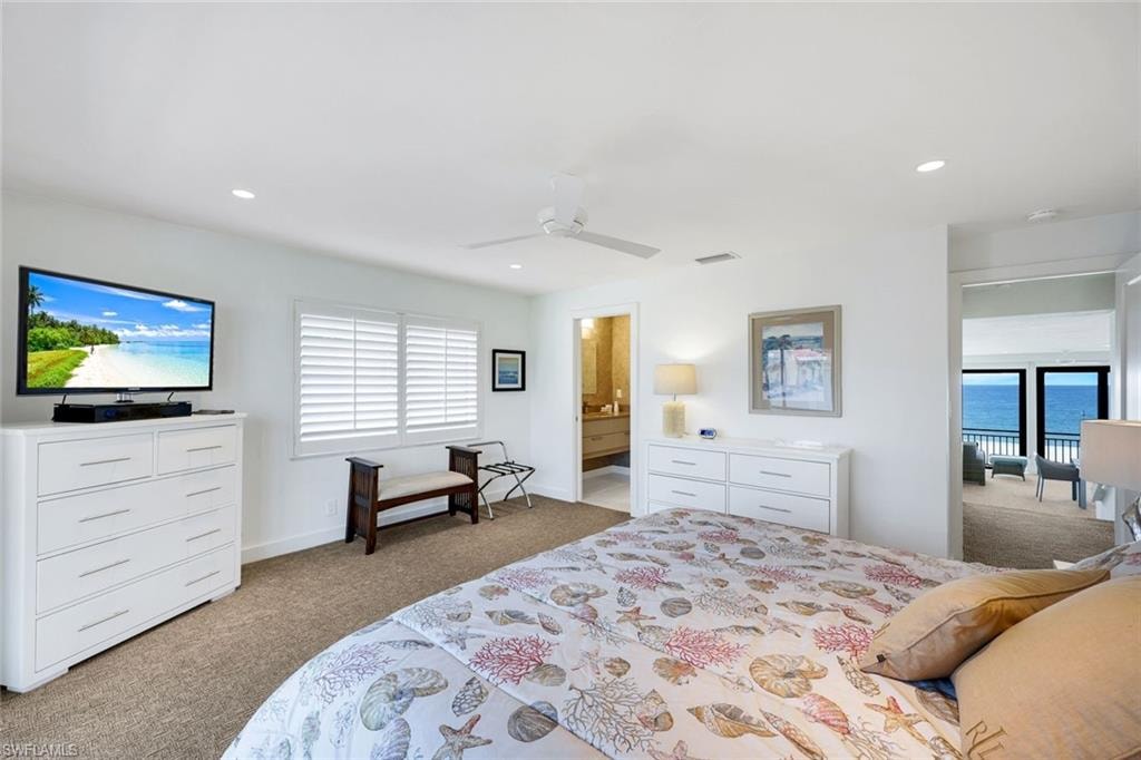 Bedroom featuring light carpet, a ceiling fan, and recessed lighting