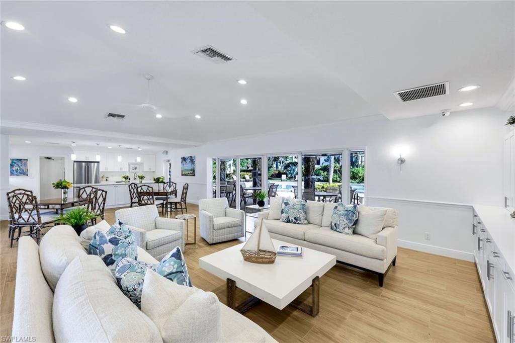 Living area featuring recessed lighting and light wood-style flooring