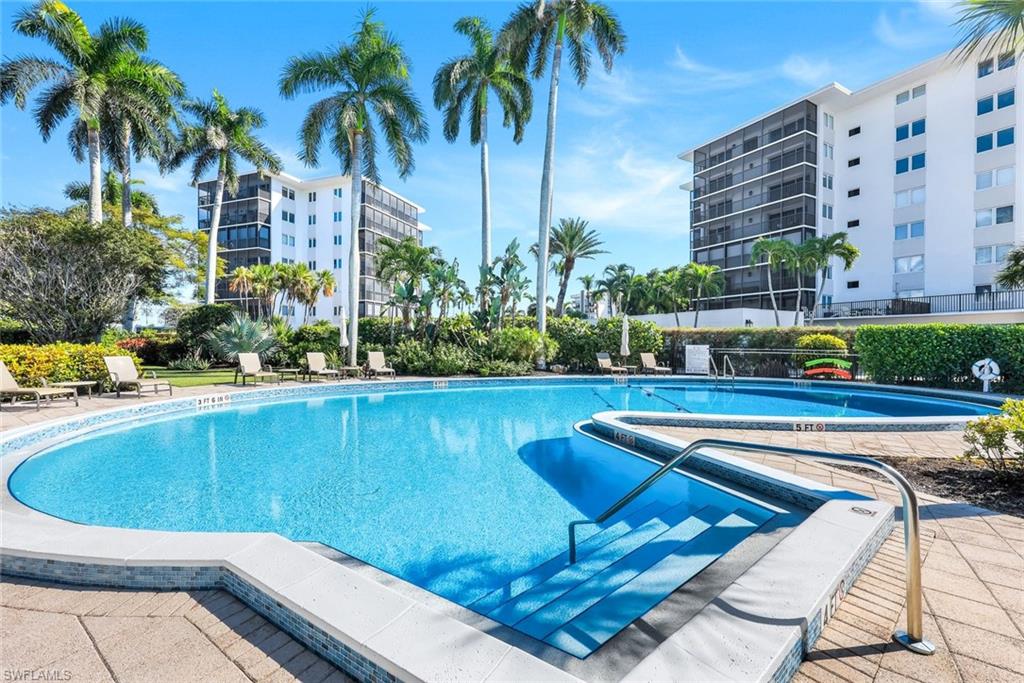 Community pool featuring a patio