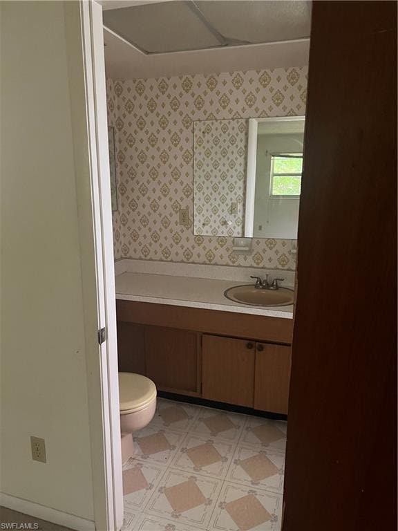 Bathroom with vanity and toilet