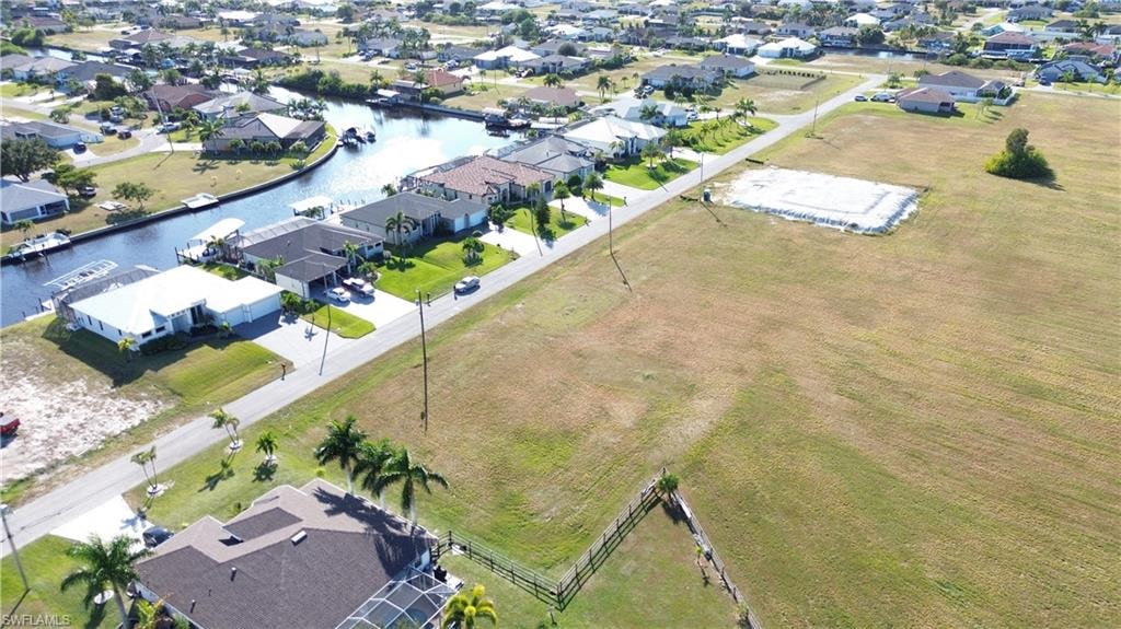 Aerial view of residential area featuring a large body of water