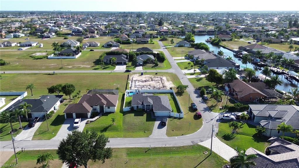 Aerial overview of property's location featuring nearby suburban area
