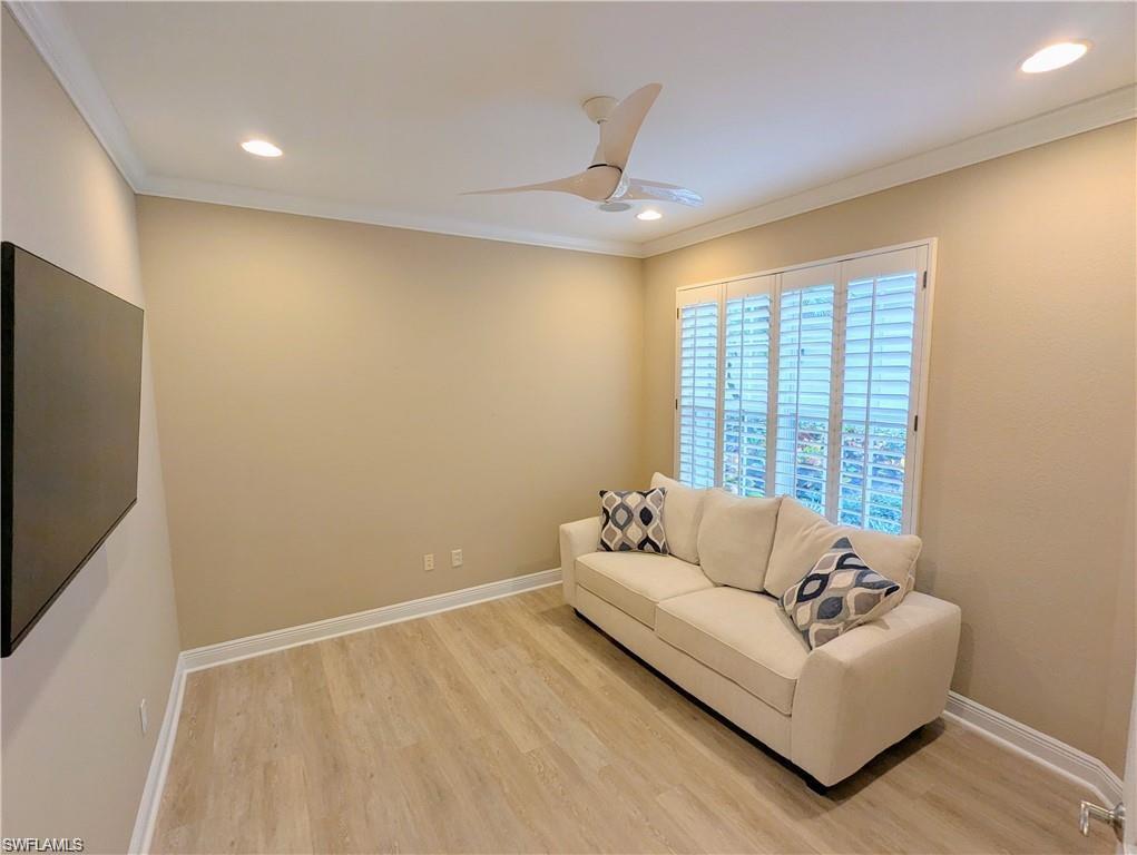 Living area featuring light wood-style flooring, ornamental molding, recessed lighting, and ceiling fan