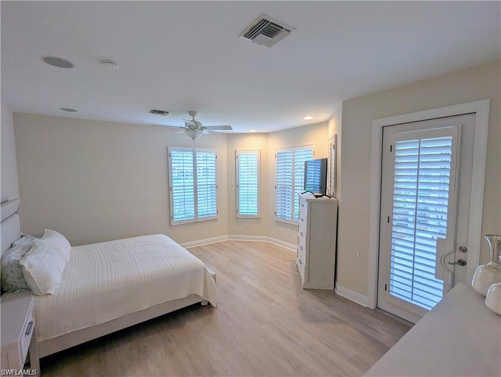 Bedroom featuring light wood finished floors, access to outside, ceiling fan, and recessed lighting