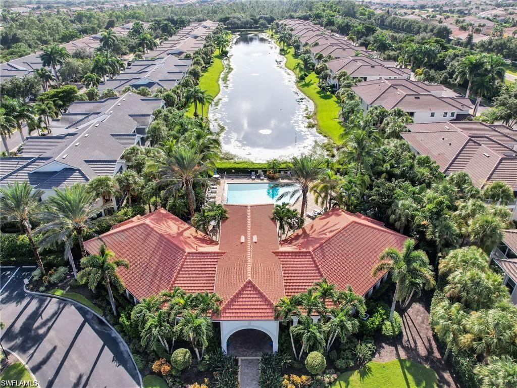 Aerial perspective of suburban area with a large body of water