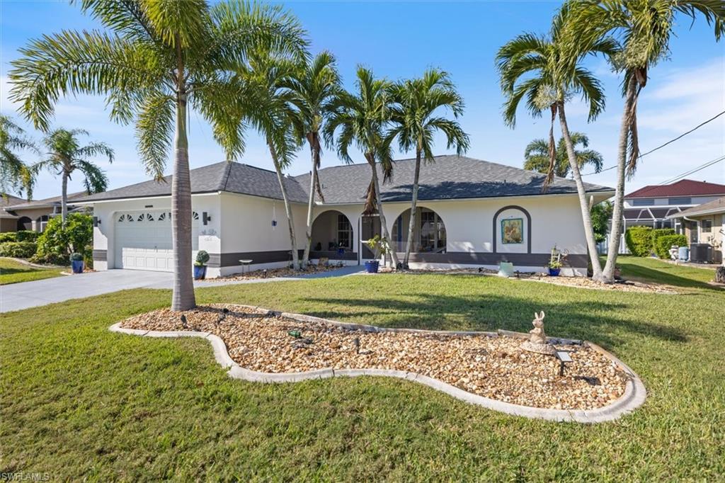 Ranch-style house with stucco siding, roof with shingles, a front lawn, and an attached garage