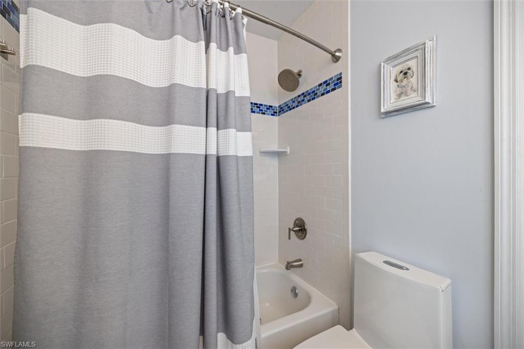 Bathroom with shower / bath combo and toilet