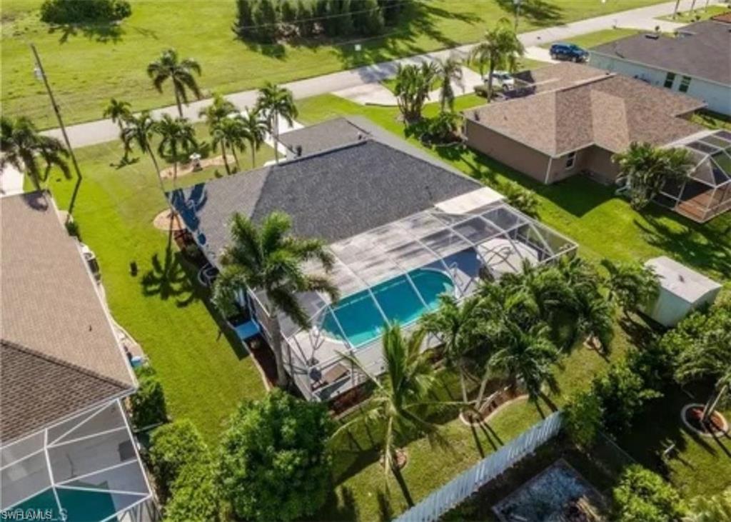 Aerial perspective of suburban area featuring a pool area