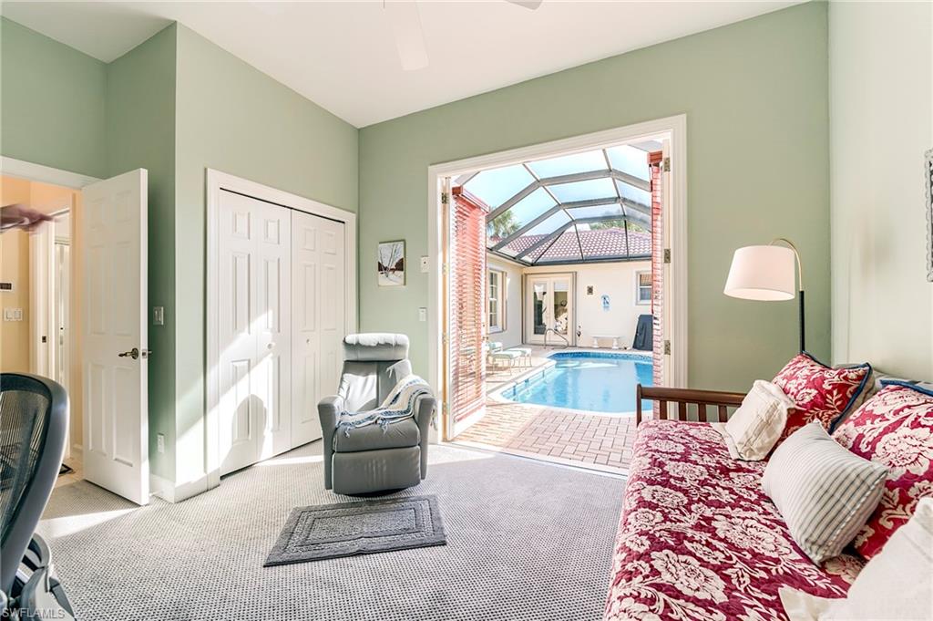 Bedroom 3 with French doors open to the pool