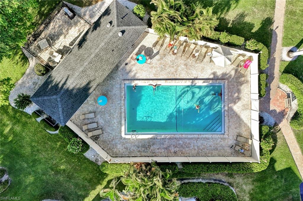 Huge Community Pool- Bath house- Grills- Tropical Gathering Area