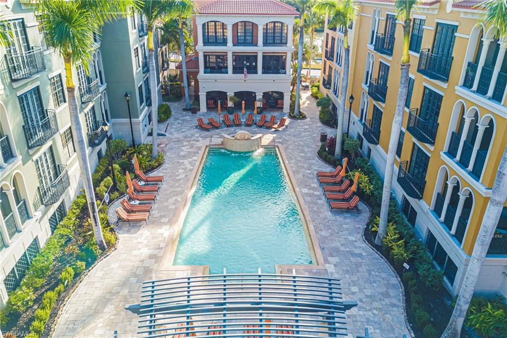 Community pool with a patio