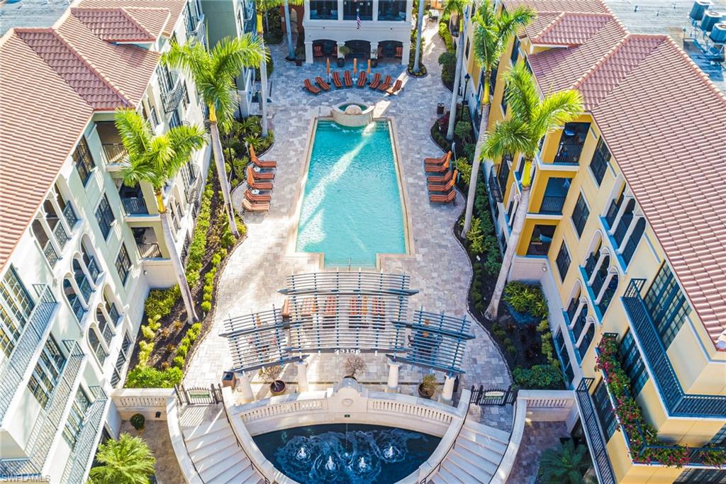 Community pool featuring a patio area and a hot tub