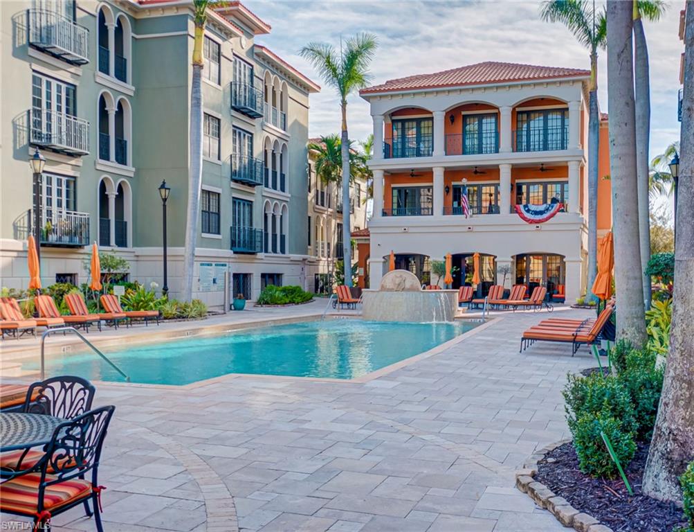 Community pool with a patio