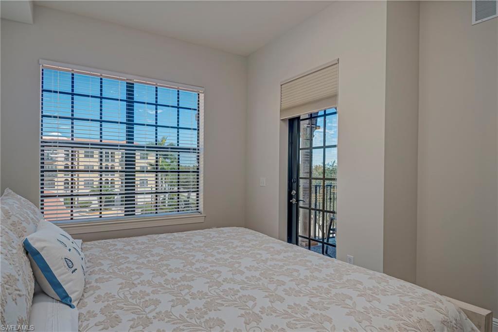 Primary bedroom has access to screened-in lanai and plenty of natural light, walk-in shower, and ensuite bathroom