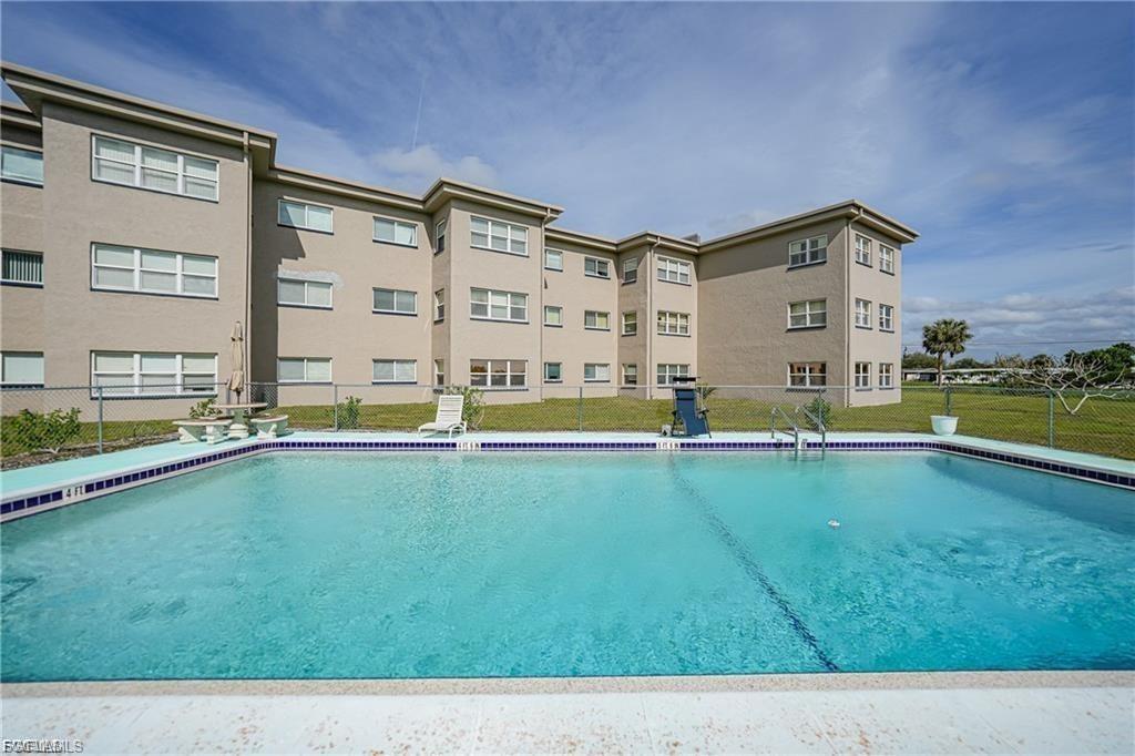 Community pool featuring a patio
