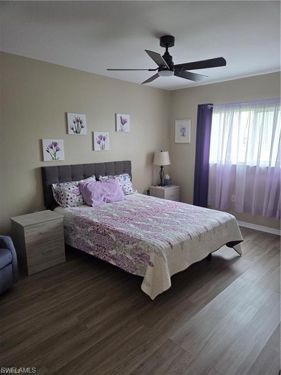 Bedroom featuring wood finished floors and a ceiling fan