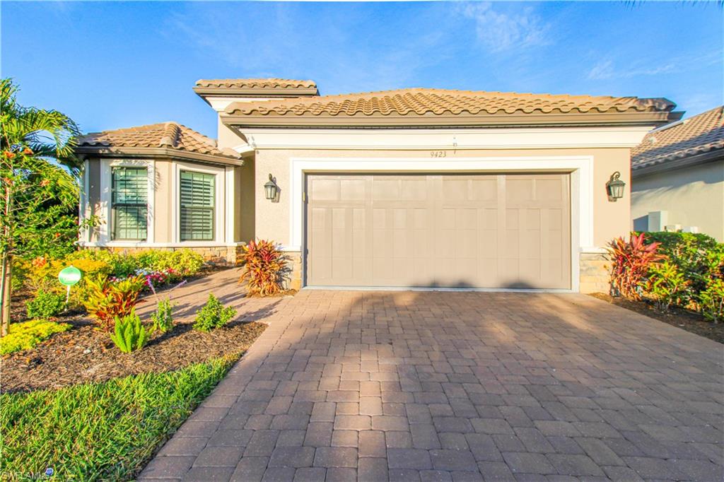 Mediterranean / spanish-style home featuring a garage
