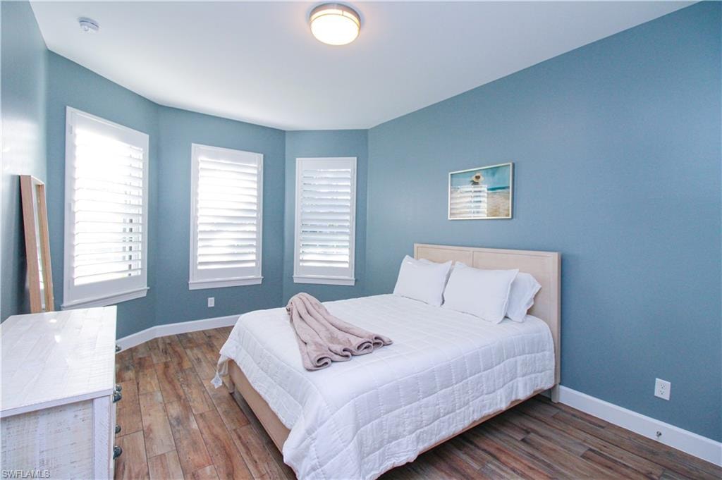 Bedroom featuring dark hardwood / wood-style floors