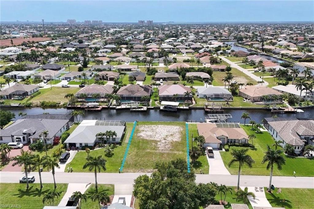 Aerial view of residential area with a large body of water