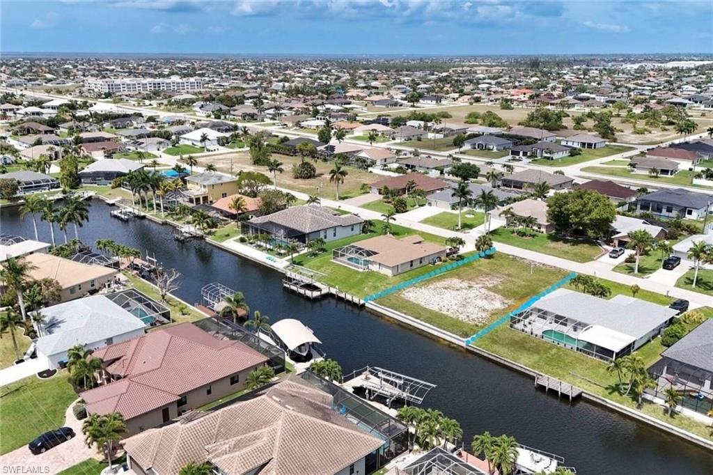 Aerial view of residential area with a nearby body of water