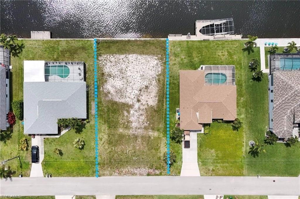 Aerial overview of property's location featuring property parcel outlined and a large body of water
