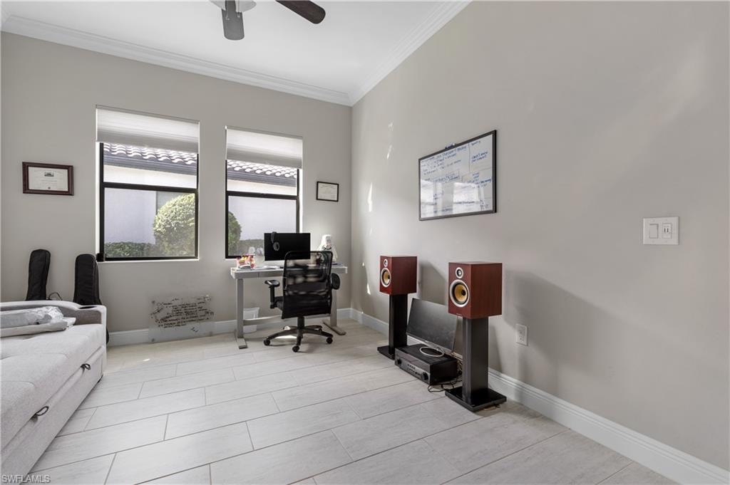 Office featuring crown molding, light tile patterned floors, and ceiling fan
