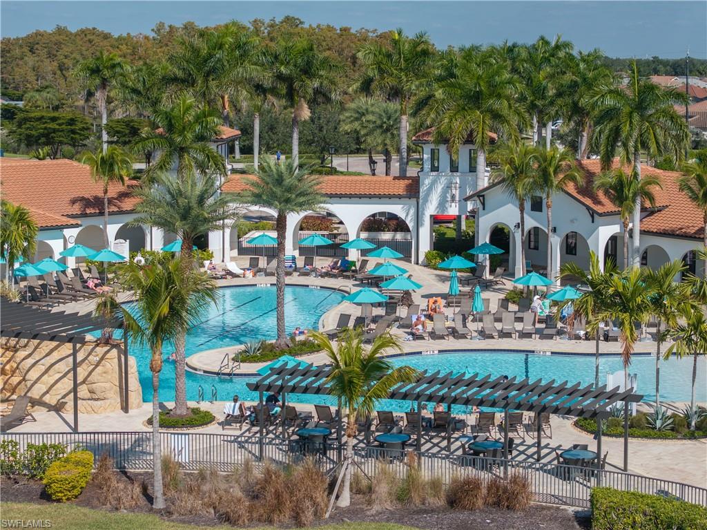 Community pool with a patio and a pergola