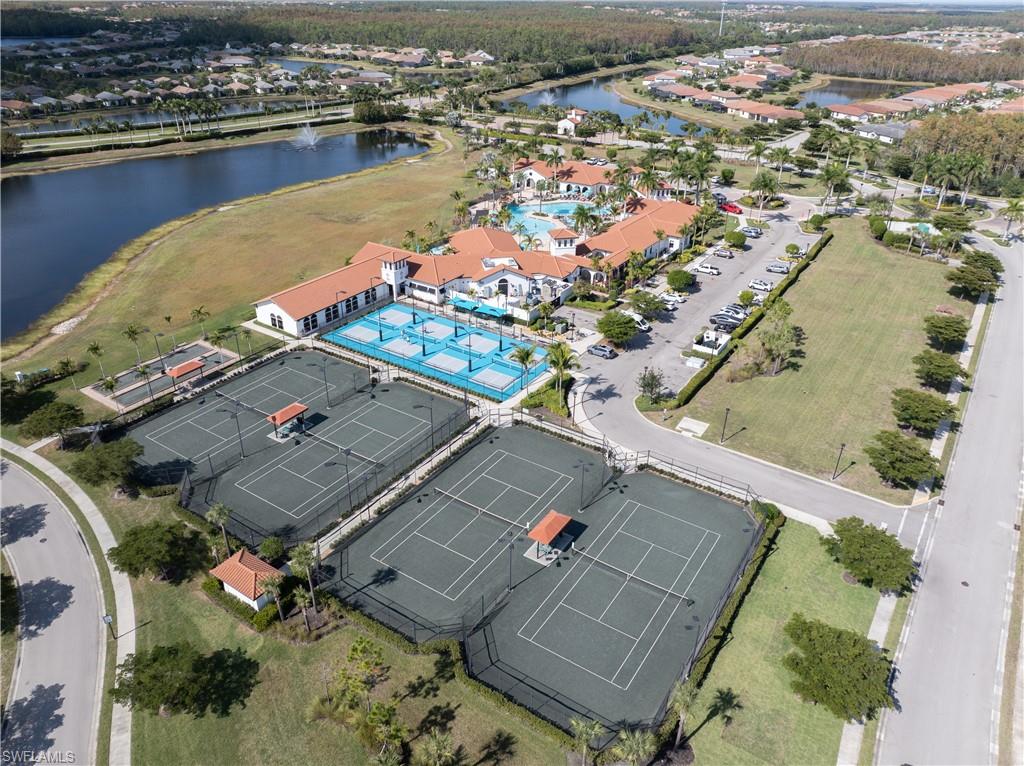 Bird's eye view of a nearby body of water and a pool