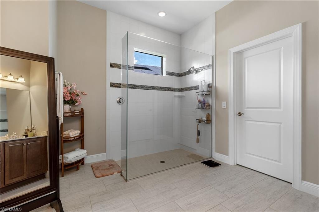 Bathroom with a walk in shower and vanity