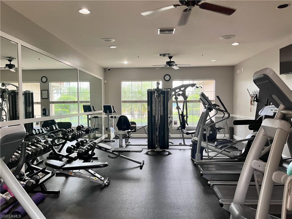 Exercise room with a ceiling fan and recessed lighting