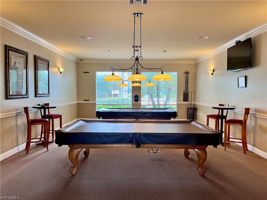 Game room with pool tables and TV