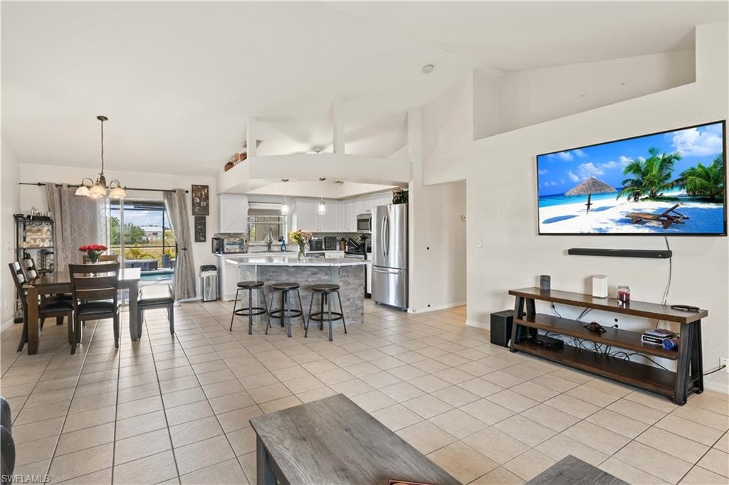 The kitchen seamlessly flows into the expansive living room, making it perfect for both family gatherings and entertaining guests.