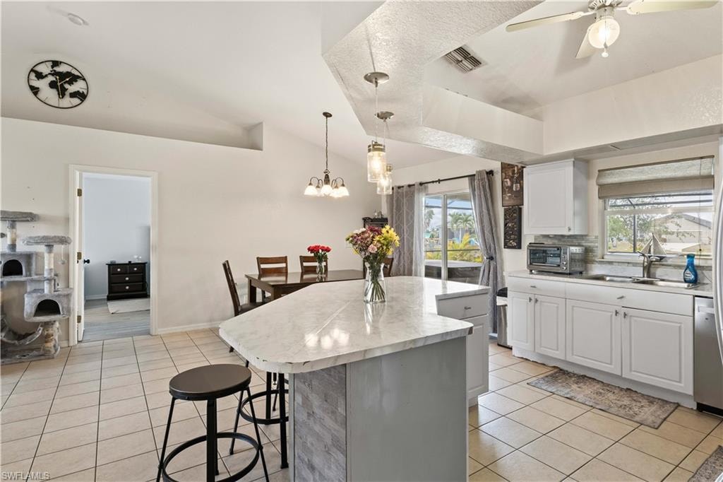 With its open layout, the kitchen's modern design and spacious island naturally extend into the dining room, making it easy to interact with family and guests.